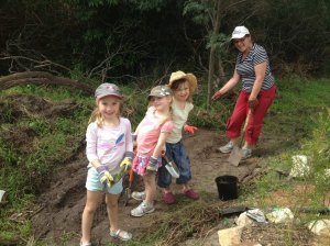 The girls were really keen on helping to put some left-over seed potatoes (thanks, Elaine!) into the ground. Even the smell of cow poo didn't stop them having a good time planting and watering. 